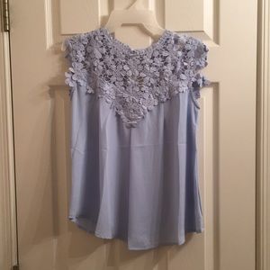 Blue sleeveless blouse